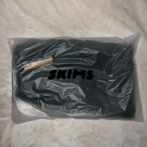 Skims dark green sweats flared